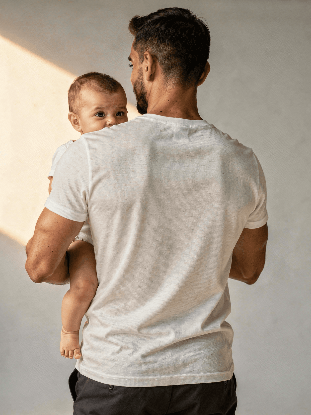 White Cotton Baby Onesie Mockup on Model - Park — Back View on Model