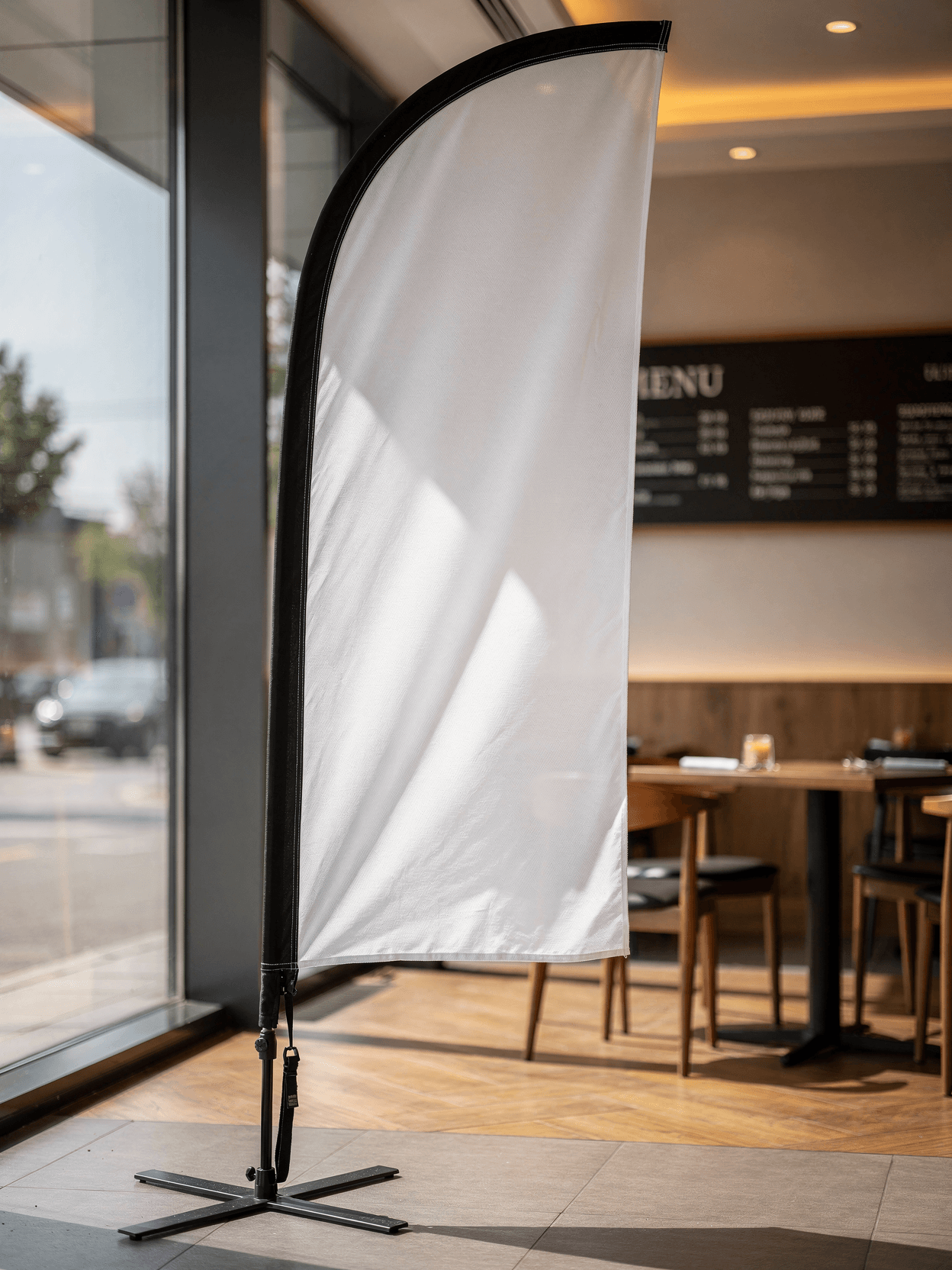 White Vinyl Feather Flag Mockup - Cafe Interior