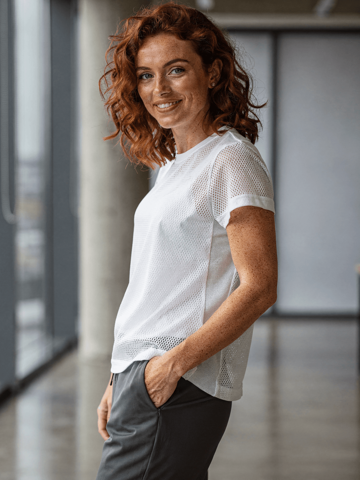 White Mesh Jersey Mockup on Female Model - Office