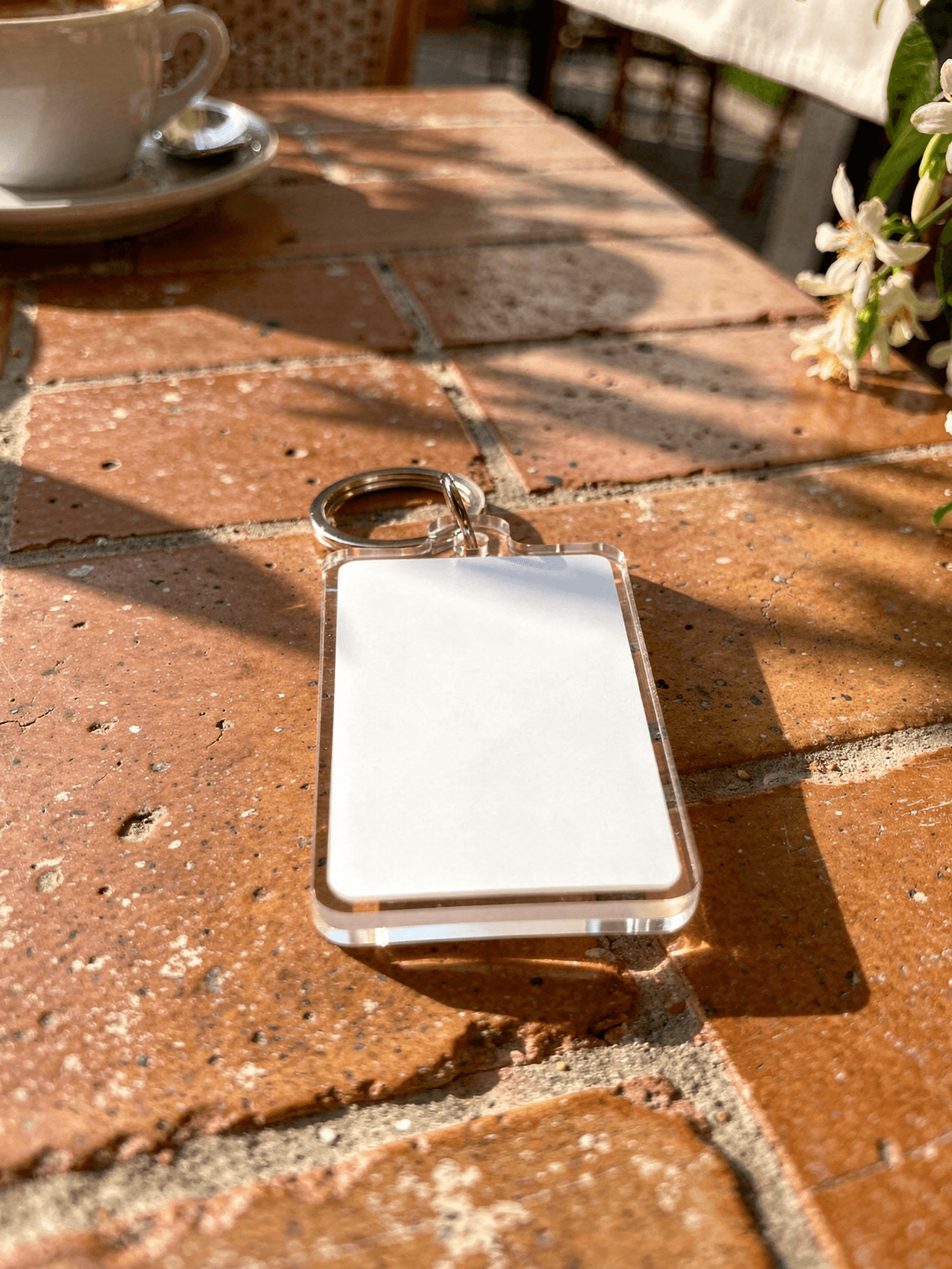 White Acrylic Keychain Mockup - Café Terracotta — 45-Degree Angled View