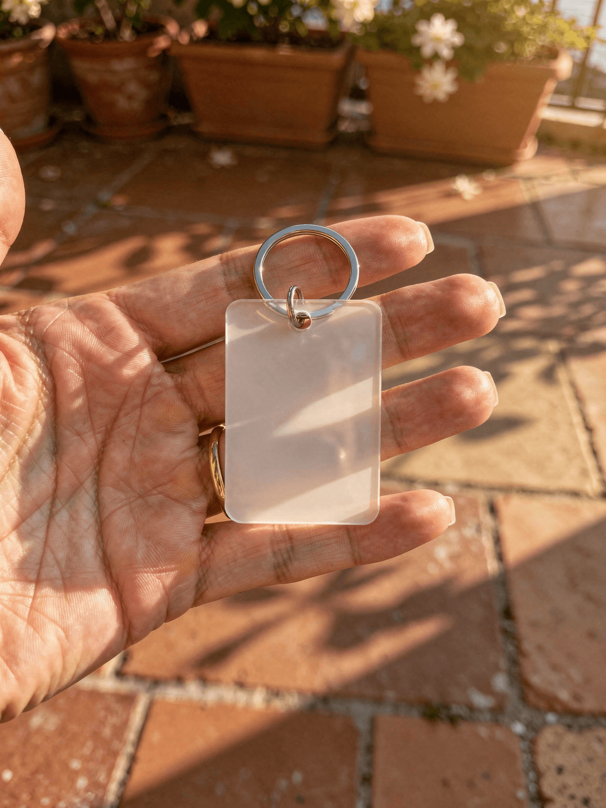 White Acrylic Keychain Mockup - Terracotta Setting — Hanging In-Use Position