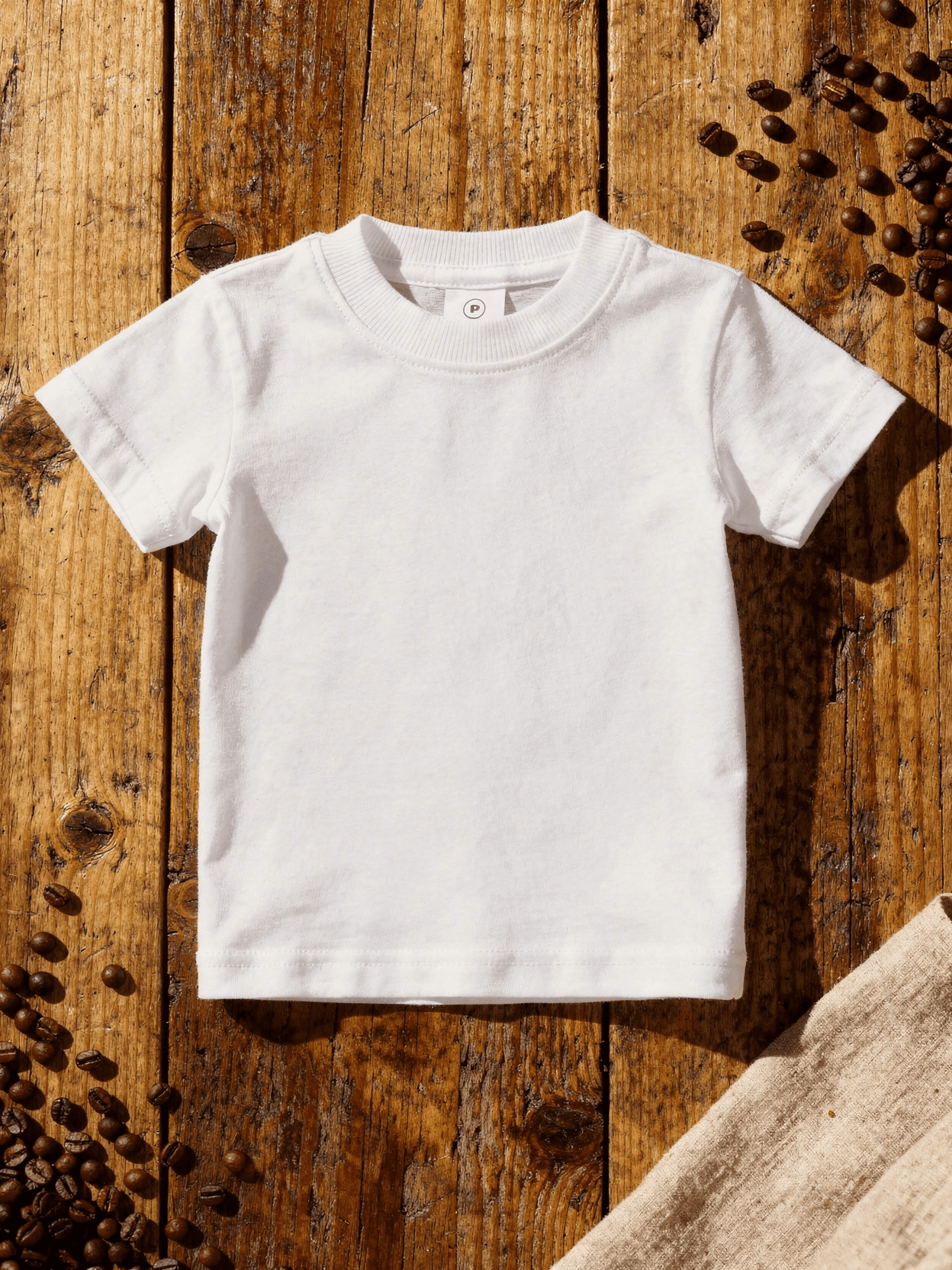 White Bella Canvas 3001Y Youth T-Shirt Mockup — Flat Lay Overhead