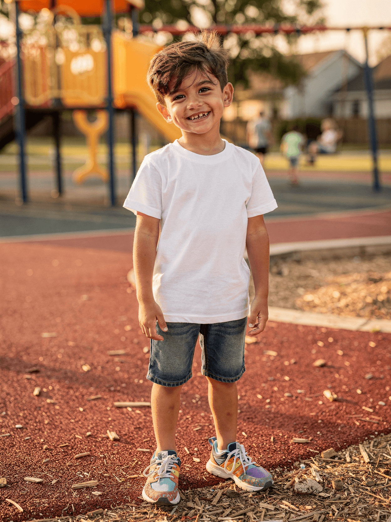 White Kids T-Shirt Mockup on Boy at Playground