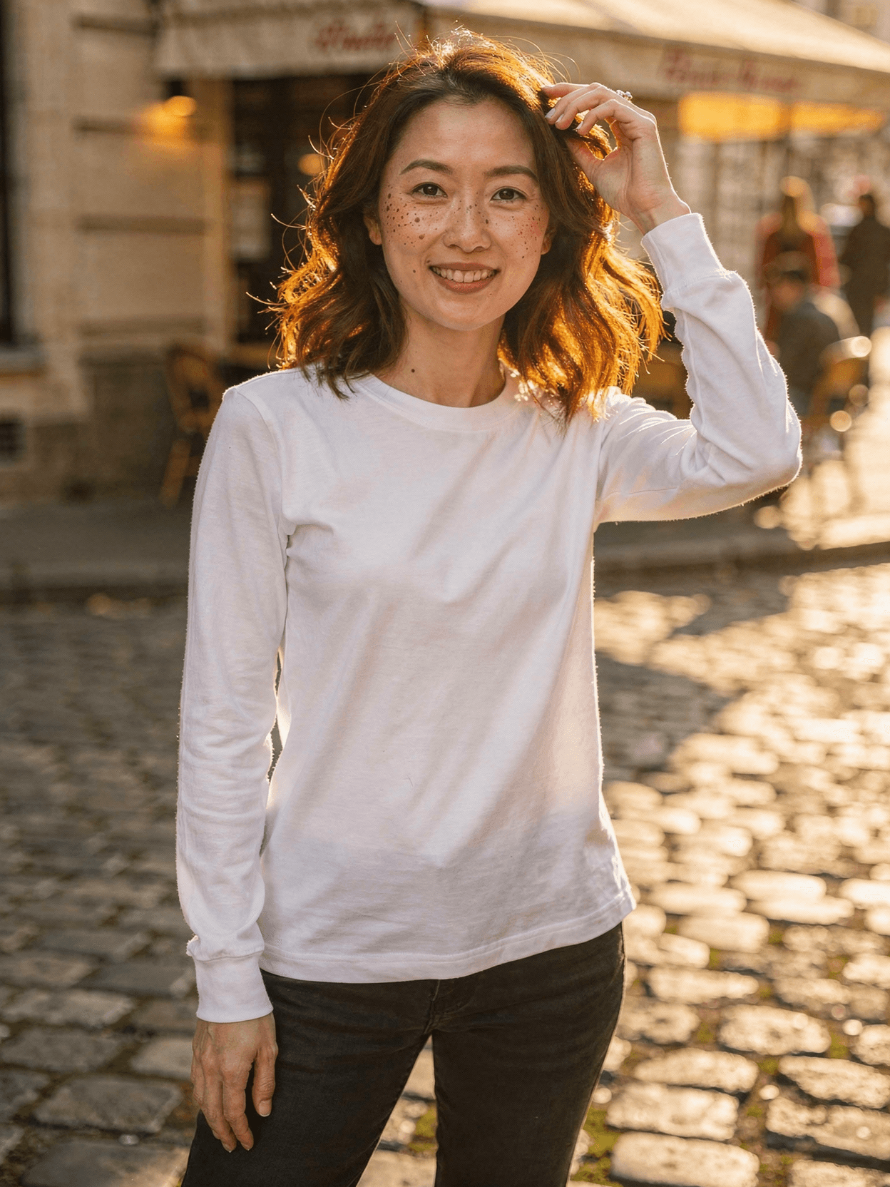 White Long Sleeve Tee Mockup on Female Model — Three-Quarter Angle