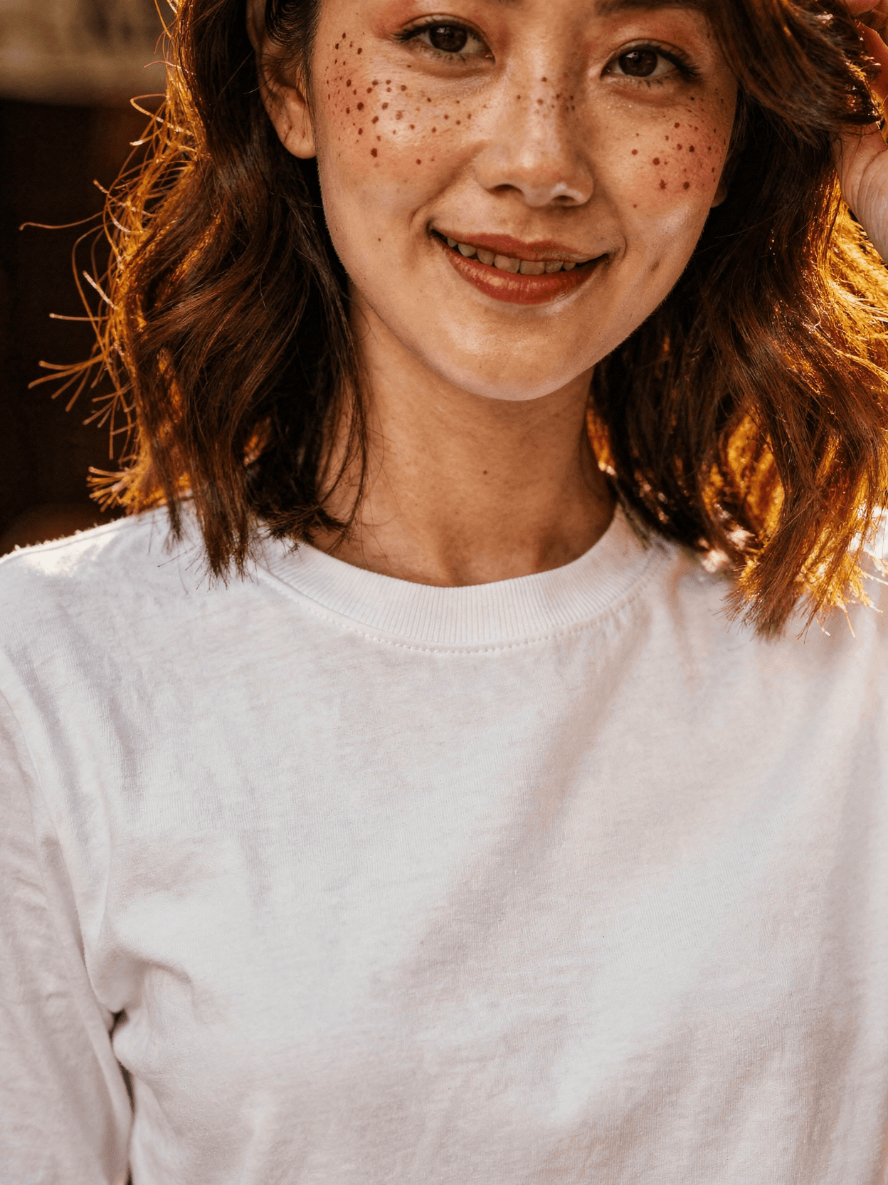 White Long Sleeve Tee Mockup on Female Model — Collar & Neckline Detail