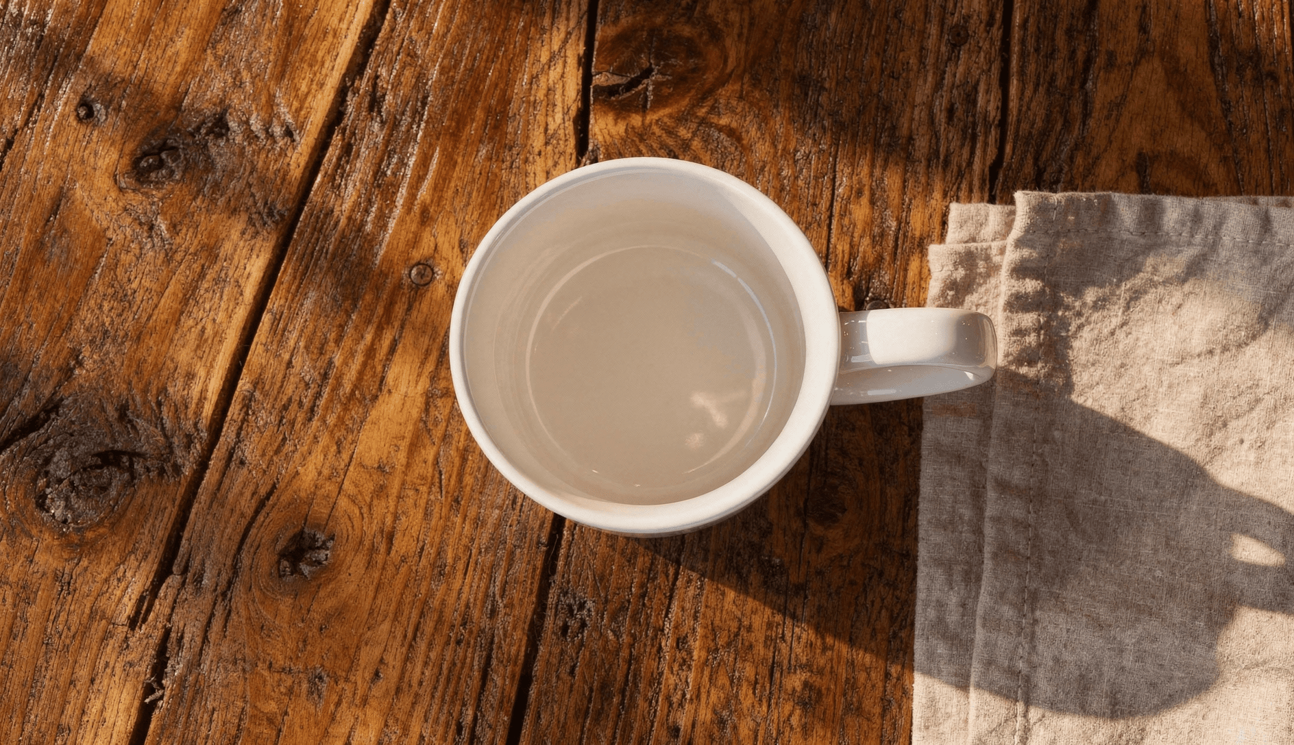 White Ceramic Magic Mug Mockup - Café Setting — Top-Down Interior View