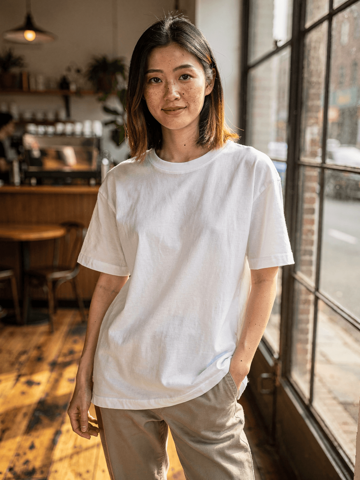 White Oversized Tee Mockup on Female Model - Cafe