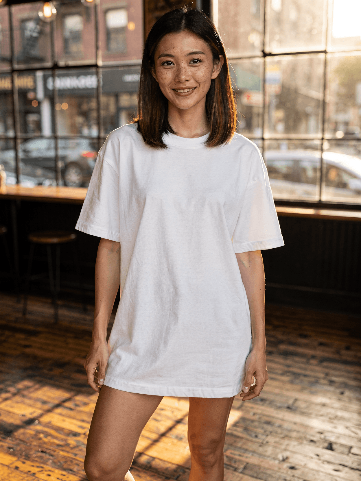 White Oversized Tee Mockup on Female Model - Cafe