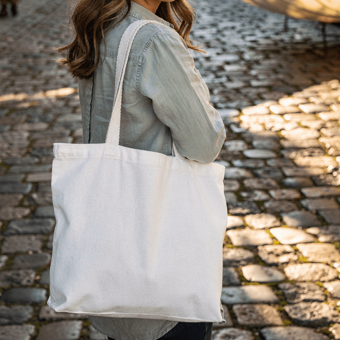 White Canvas Tote Bag Mockup - Cobblestone Setting