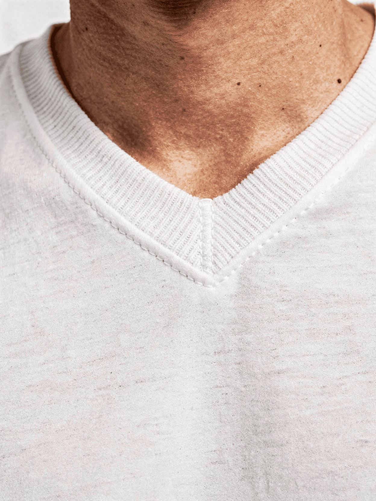 White Polyester V-Neck T-Shirt Mockup on Male Model — V-Neck Detail Close-Up