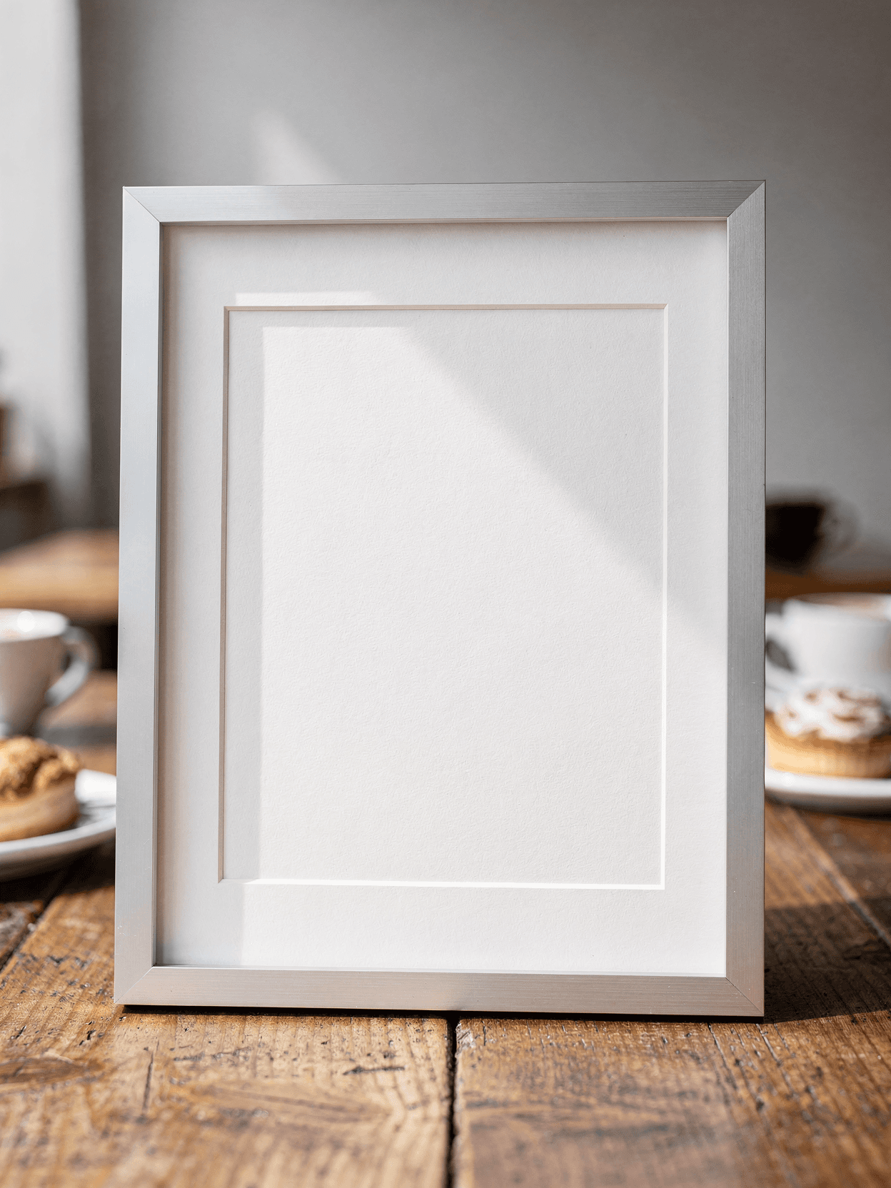 White Framed Print Mockup – Café Lifestyle Setting