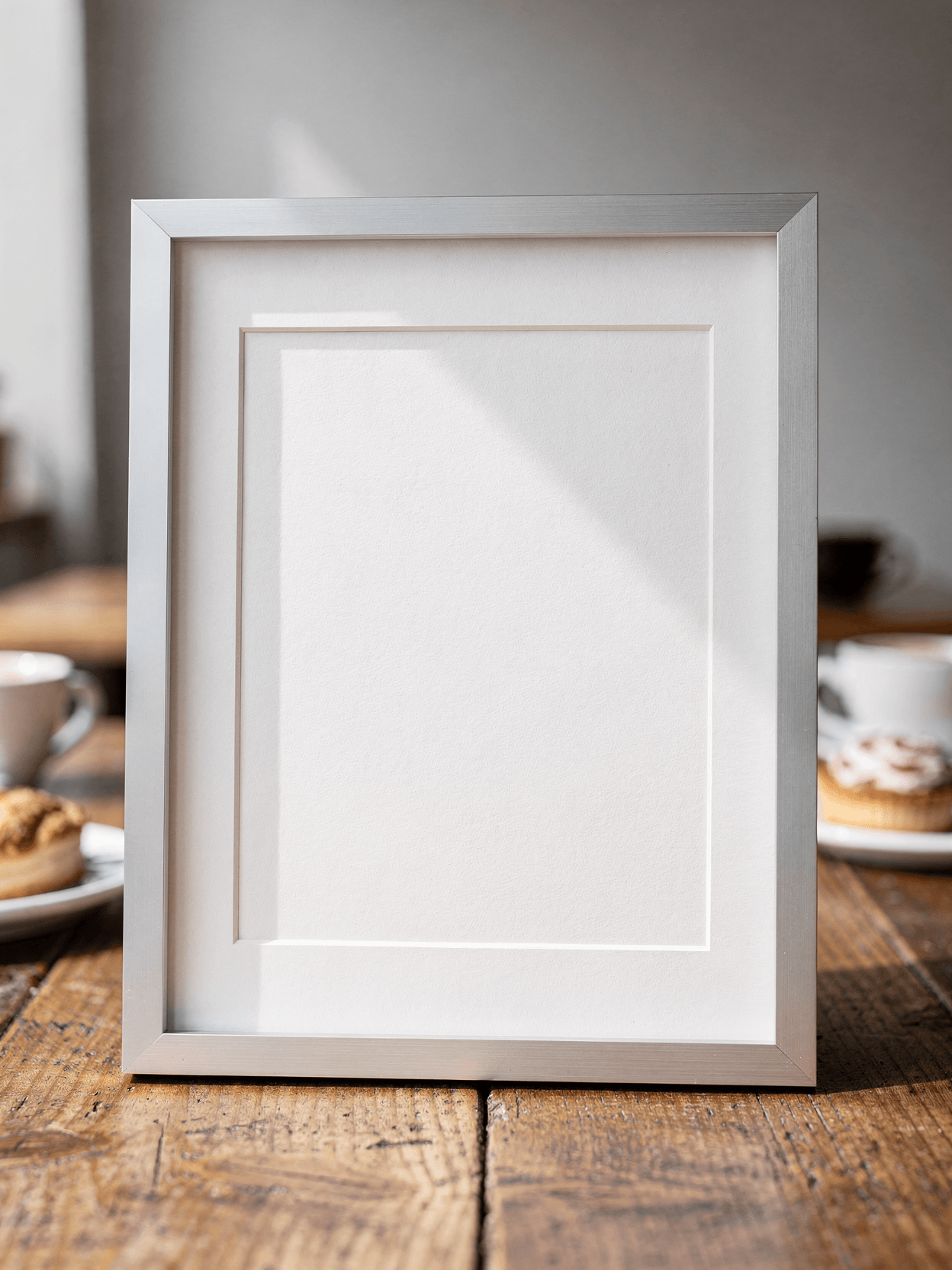 White Framed Print Mockup – Café Lifestyle Setting