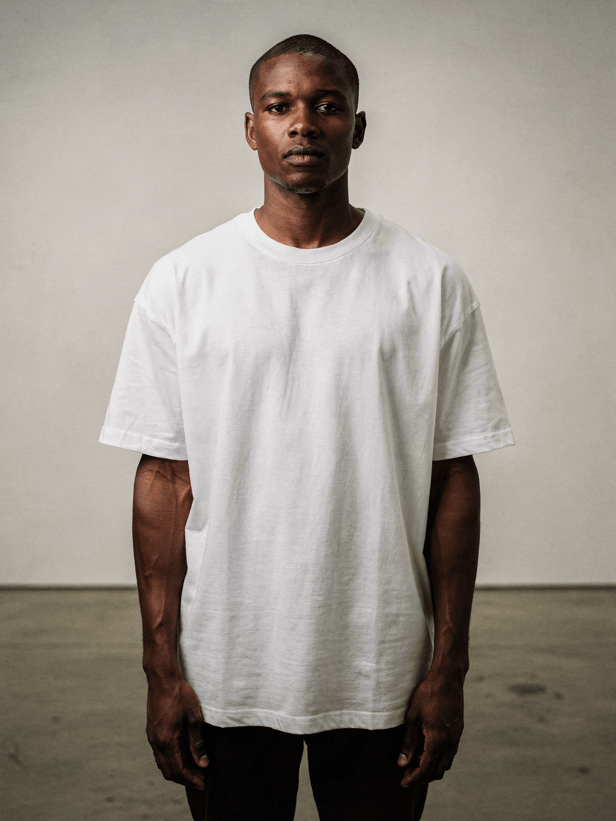 White Oversized Tee Mockup – Gallery Setting